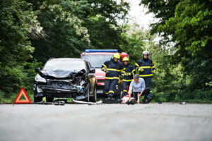 Firefighters,Running,To,Rescue,A,Woman,Lying,Unconscious,On,The