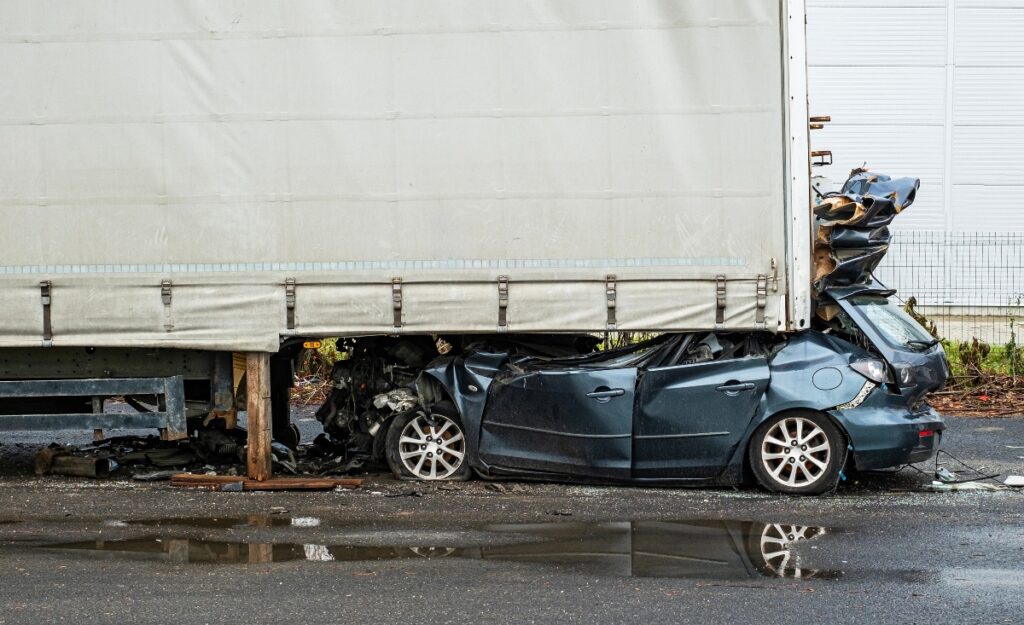 type of truck accident car crash into tractor trailer