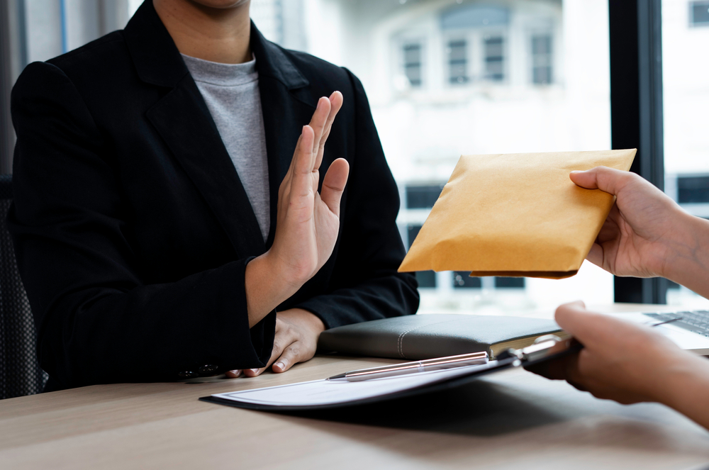 businesswoman accountant rejecting resisting partner bribery
